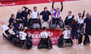 Team members of Britain celebrate after winning gold.