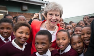 Theresa May with school pupils in Gugulethu, near Cape Town, South Africa.