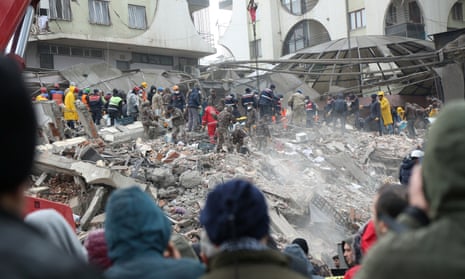 Rescue workers search for survivors under the rubble following an earthquake in Diyarbakir, Turkiye.