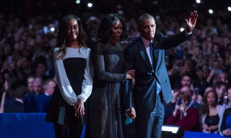 President Barack Obama, first lady Michelle Obama and daughter Malia Obama wave goodbye to supporters after Obama’s farewell address.