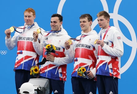 Tom Dean, James Guy, Matthew Richards and Duncan Scott of Great Britain after winning the 4x200m Freestyle Relay in Tokyo.