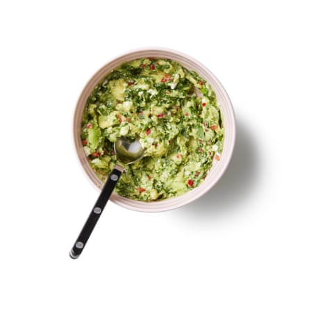 7 … and then the guacamole. For the guacamole, whizz In a mini-chopper or mortar, blitz or pound the chilli and, coriander and a little lime juice to a paste in a mini chopper or pestle and mortar with a little lime juice. Add the avocado flesh, mash or whizz until fairly smooth, then add more lime to taste. Add a splash of just enough cold water to loosen it, then stir in the crumbled cheese, if using, and season to taste.