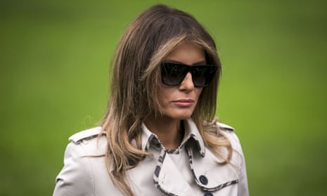 Melania Trump is shades and raincoat