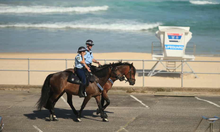 Police on horseback patrol Bondi beach in Sydney