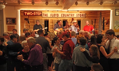A crowd dances in front of a bluegrass band playing at  Floyd Country Store, Floyd, Virginia.