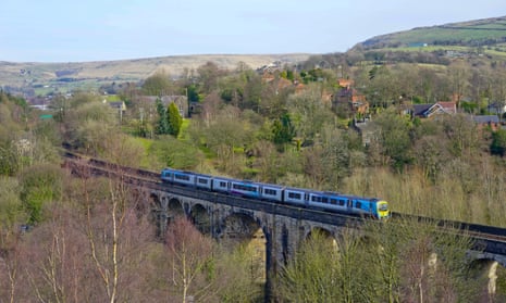 A Trans-Pennine train crosses Uppermill viaduct at Saddleworth, Greater Manchester