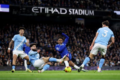 Estevao of Chelsea has a shot blocked by Josko Gvardiol.