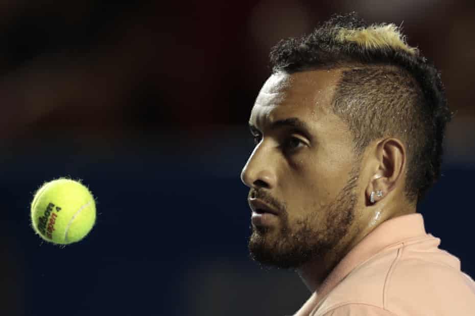 Australia’s Nick Kyrgios tosses a ball in the air as he waits to serve