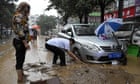 China floods: military blasts dam to release water as death toll climbs