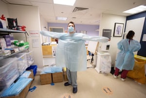 Theo Reback starts his shift and changes in to his PPE.