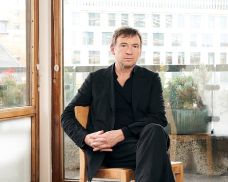 David Nicholls sitting on a chair.