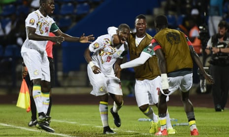 Senegal’s Papakouli Diop celebrates with teammates after scoring an equaliser.