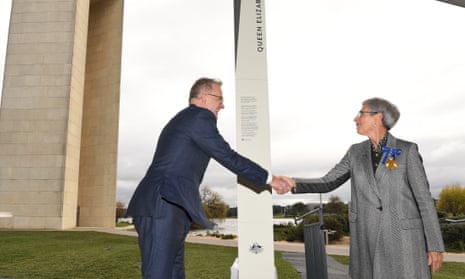 Prime minister Anthony Albanese and Commonwealth administrator Linda Dessau unveil a sign at the ceremony to rename Aspen Island to Queen Elizabeth II Island in Canberra