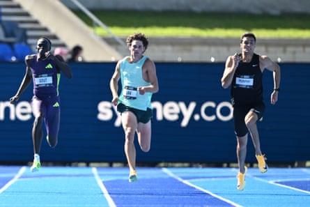Gout Gout (left) and Aidan Murphy (right) race in the men’s 200m final at the 2026 Australian Athletics Championships