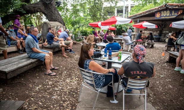 People sit al fresco at a bar and restaurant in Austin, Texas, on 28 June.