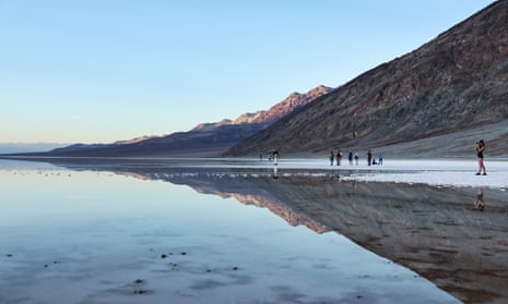 Visitors gather at the sprawling temporary lake in the Badwater Basin salt flats of Death Valley national park, California.