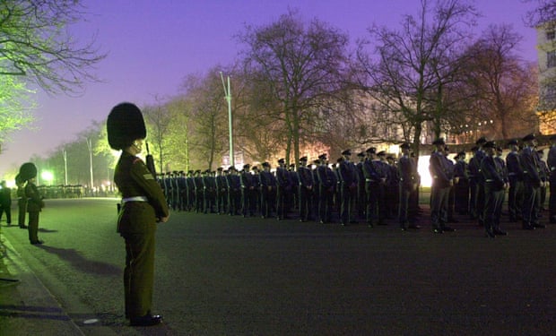 Guards march down the Mall during a dress rehearsal for the Queen Mother's funeral in 2002. Arrangements for the Queen's funeral will follow a similar pattern.