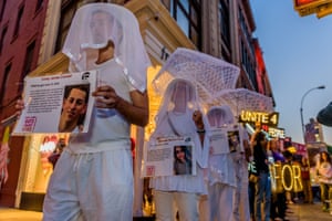 People wearing veils take part in an anti-gun march from Union Square Park to Times Square in New York City