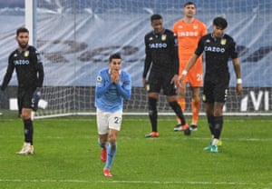 Manchester City’s Joao Cancelo reacts after his shot hit the bar.