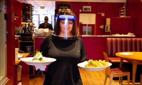 A restaurant waitress at work in Brighton. 