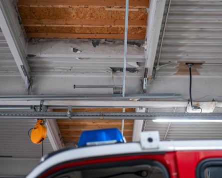 Missing ceiling tiles above a fire engine