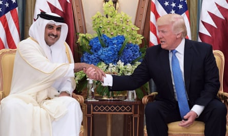 Donald Trump shakes hands with Qatar’s Emir Sheikh Tamim Bin Hamad Al-Thani.