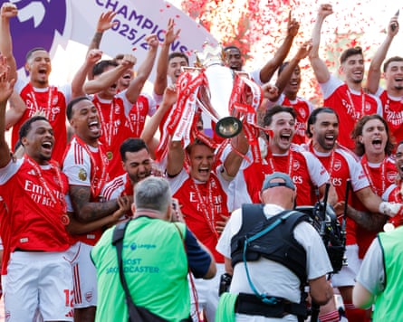 Arsenal players and staff celebrate at the Premier League trophy presentation ceremony on the pitch after the Premier League football match between Crystal Palace and Arsenal at Selhurst Park in south London