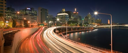 Long exposure photo of Brisbane’s Riverside Expressway at night showing lines of car lights on the road