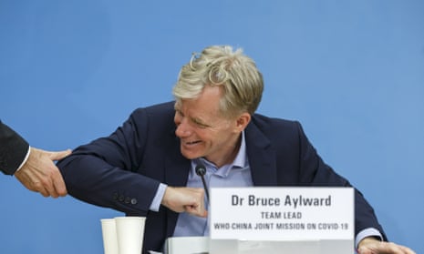 The World Health Organization’s Bruce Aylward offers an elbow to a reporter reaching out for a handshake at the end of press conference.