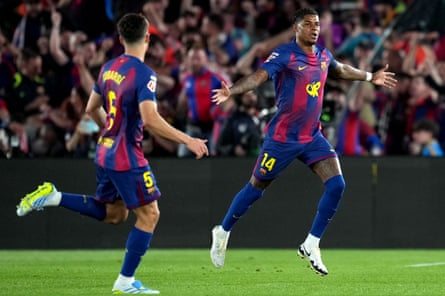 Marcus Rashford of Barcelona celebrates scoring his team’s first goal against Real Madrid with teammate Pau Cubarsí