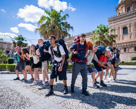 People with rucksacks ready to race