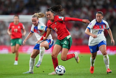 Portugal’s Carolina Correia holds off a challenge from England’s Beth Mead during their Nations League match.