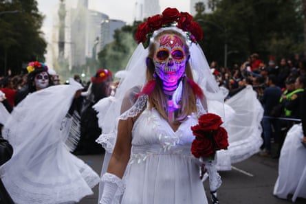 A corpse bride parades down Reforma avenue.