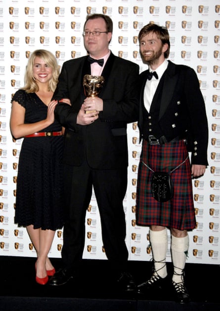 Russell T Davies (centre) with Doctor Who stars Billie Piper and David Tennant after winning a Bafta in 2006.