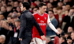 Mikel Arteta with Mesut Özil last February. The manager says he wants to ‘try to find the best solution for everyone’.