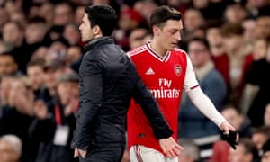 Mesut Özil pictured with Arsenal’s manager, Mikel Arteta, last February. The German playmaker’s contract expires in the summer.