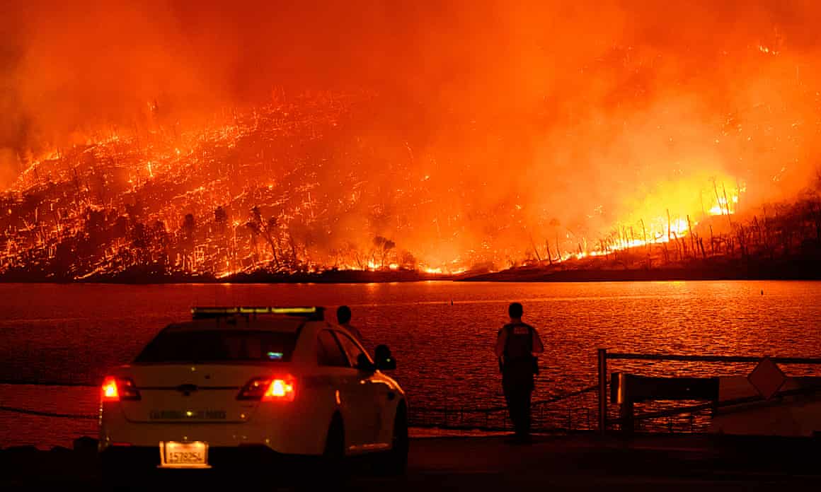 Person looking at wildfire in distance