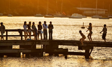 People jumping into Swan River from Bicton Jetty, Bicton. Perth, Western Australia, Australia.