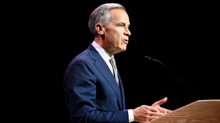 Mark Carney speaking astatine a lectern