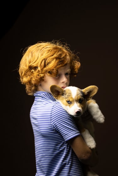 Connor Lloyd holding his dog
