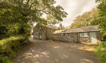 Old stone building surrounded by trees