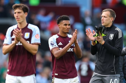 Ollie Watkins (centre) applauds the Aston Villa fans alonside Pau Torres (left) and Marco Bizot (right)