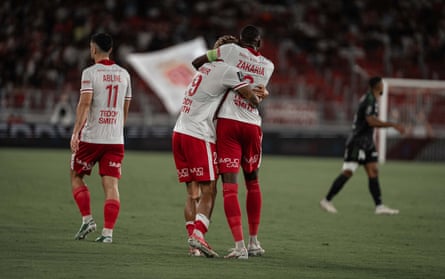 Paris Brunner and Denis Zakaria embrace after Monaco take the lead in their win against Lens