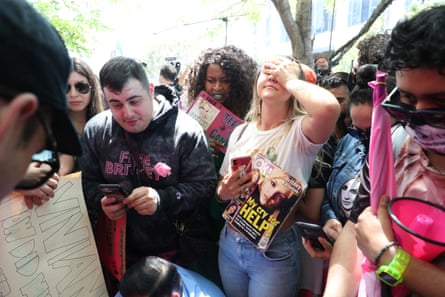 Britney Spears fans react outside the LA courthouse as they listen to a live feed from the hearing on the pop singer’s conservatorship.