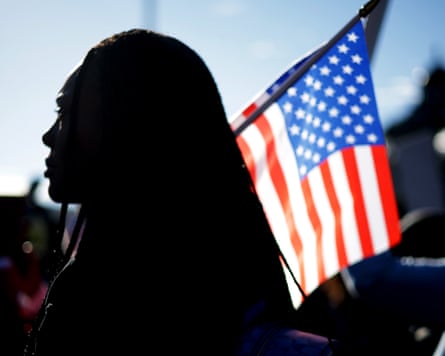 Silhouette of a woman holding a flag