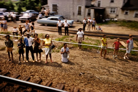 Mourners beside the railway tracks as a train takes Robert F Kennedy’s body from New York to Arlington National Cemetery, 1968