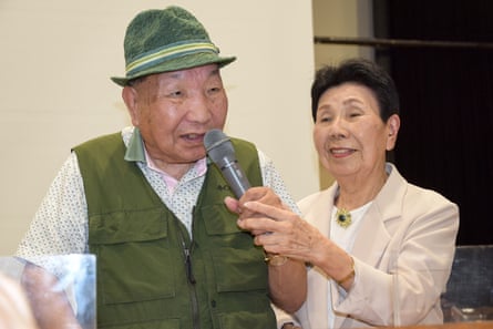 Iwao Hakamada speaks as his 91-year-old sister Hideko Hakamada holds the microphone. Decades on death row has taken a toll on his mental and physical health.
