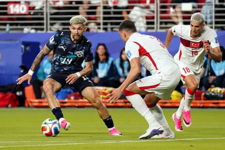 Paraguay's Julio Enciso in action with Turkey's Merih Demiral.