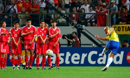 Brazil’s Roberto Carlos scores the first goal in a 4-0 win over China at the 2002 World Cup.