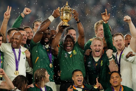 South African captain Siya Kolisi lifts the Webb Ellis Cup with the country’s president, Cyril Ramaphosa.